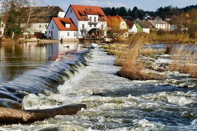 River flowing amidst buildings