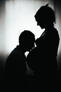 Silhouette man at home