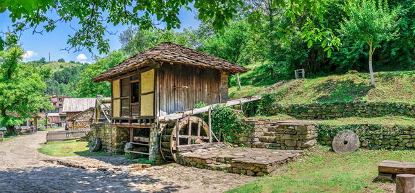 Water mill in the etar architectural ethnographic complex in bulgaria on a sunny summer day