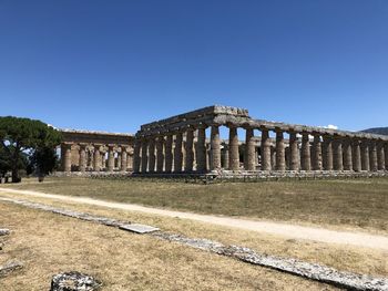 View of historical building against clear blue sky