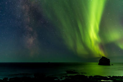 Scenic view of sea against sky at night