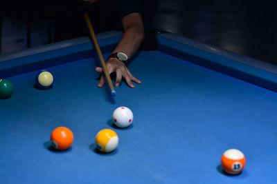 Low section of person with ball on table