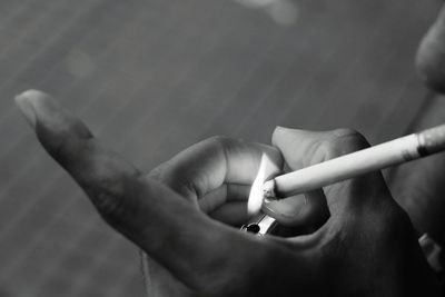 Cropped image of man smoking