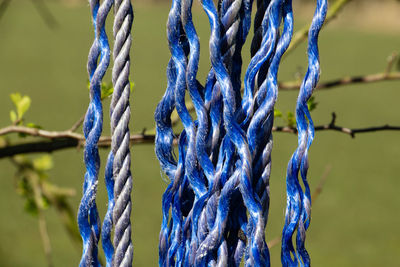 Close-up of rope tied up on metal