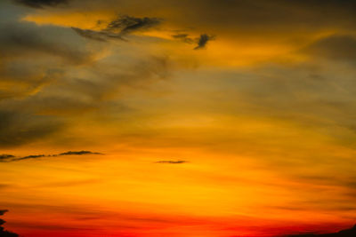 Low angle view of dramatic sky during sunset