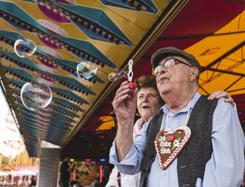 Senior couple having fun together on fair