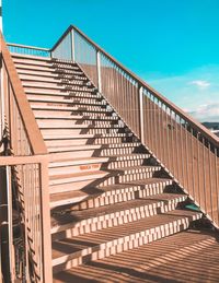 Low angle view of footbridge against sky