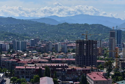 High angle view of buildings in city against sky