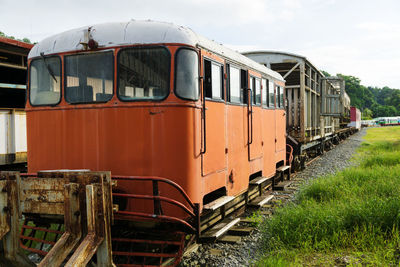 Train on field against sky