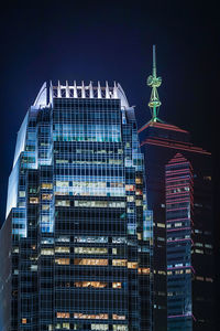 Low angle view of modern building at night