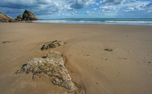 Scenic view of beach against sky