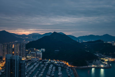 Aerial view of buildings in sea at dusk