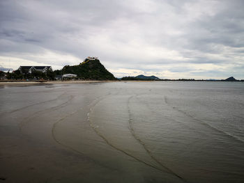 Surface level of beach against sky