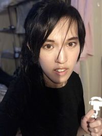 Close-up portrait of woman at home