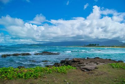 Scenic view of sea against cloudy sky