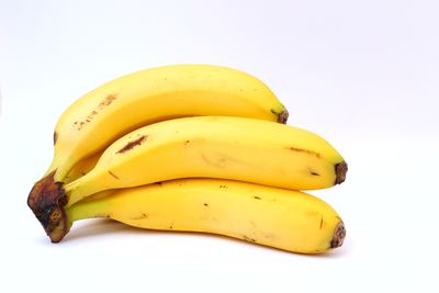 Close-up of yellow slices over white background