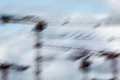 Low angle view of aircraft wing against sky during winter