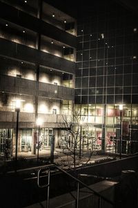 View of illuminated buildings in city at night