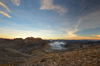 Scenic view of snowcapped mountains against sky during sunset