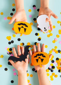 Low section of people holding hands