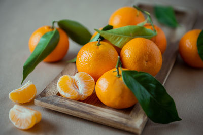 Close-up of orange fruits on cutting board