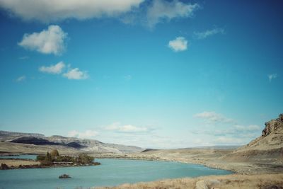 Scenic view of sea against blue sky