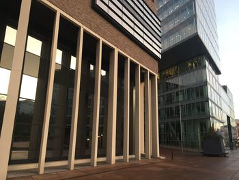 Low angle view of modern building in city against sky