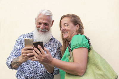 Happy woman using mobile phone