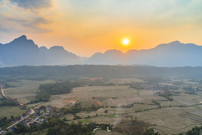 Scenic view of landscape against sky during sunset