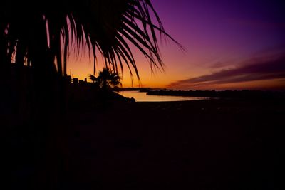 Scenic view of sea against romantic sky at sunset