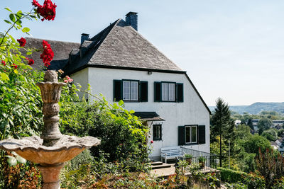 Low angle view of house and building against sky