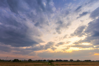 Scenic view of field against sky during sunset