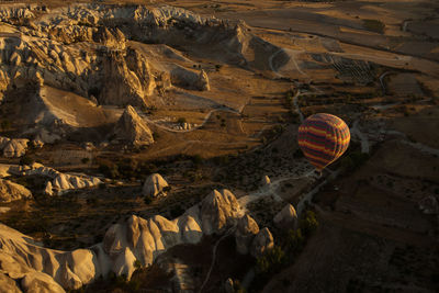 Aerial view of hot air balloon against landscape