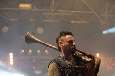 Portrait of man playing guitar