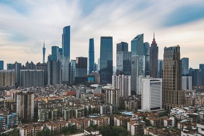 Modern buildings in city against sky