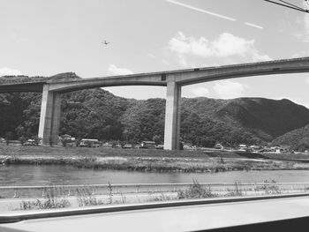 Bridge over river against sky
