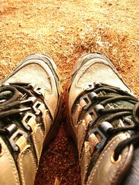 Low section of shoes on tiled floor