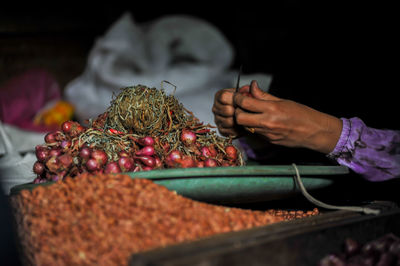 Midsection of man picking food