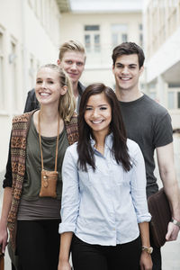 Front view portrait of happy young friends together