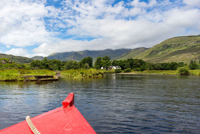 Boat on lake against mountain landscape