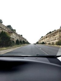 Country road seen through car windshield