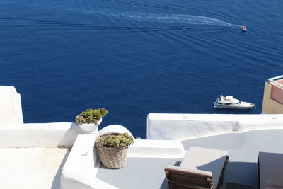 A high angle view of the coast of santorini greece.  beautiful white on blue colors.