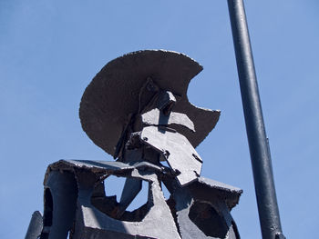 Low angle view of sculpture against clear sky