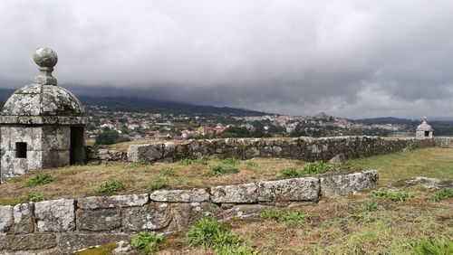 View of old ruin building against cloudy sky