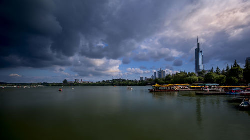 Scenic view of river against sky at dusk