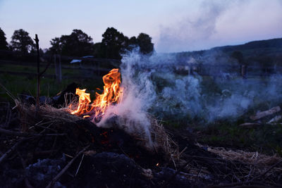 Bonfire on land during sunset