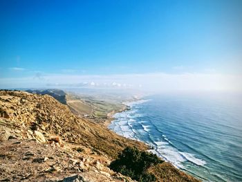 Scenic view of sea against blue sky