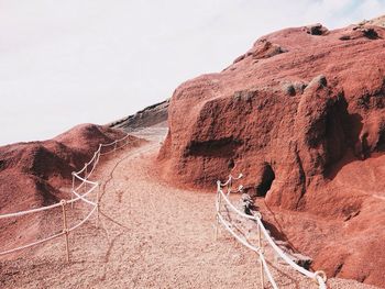 Rock formations in desert against sky