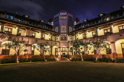 Facade of illuminated building at night