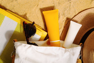 High angle view of yellow paper on bed at home